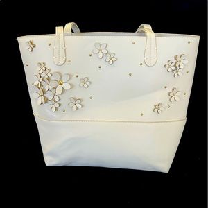 Cream colored small tote bag.